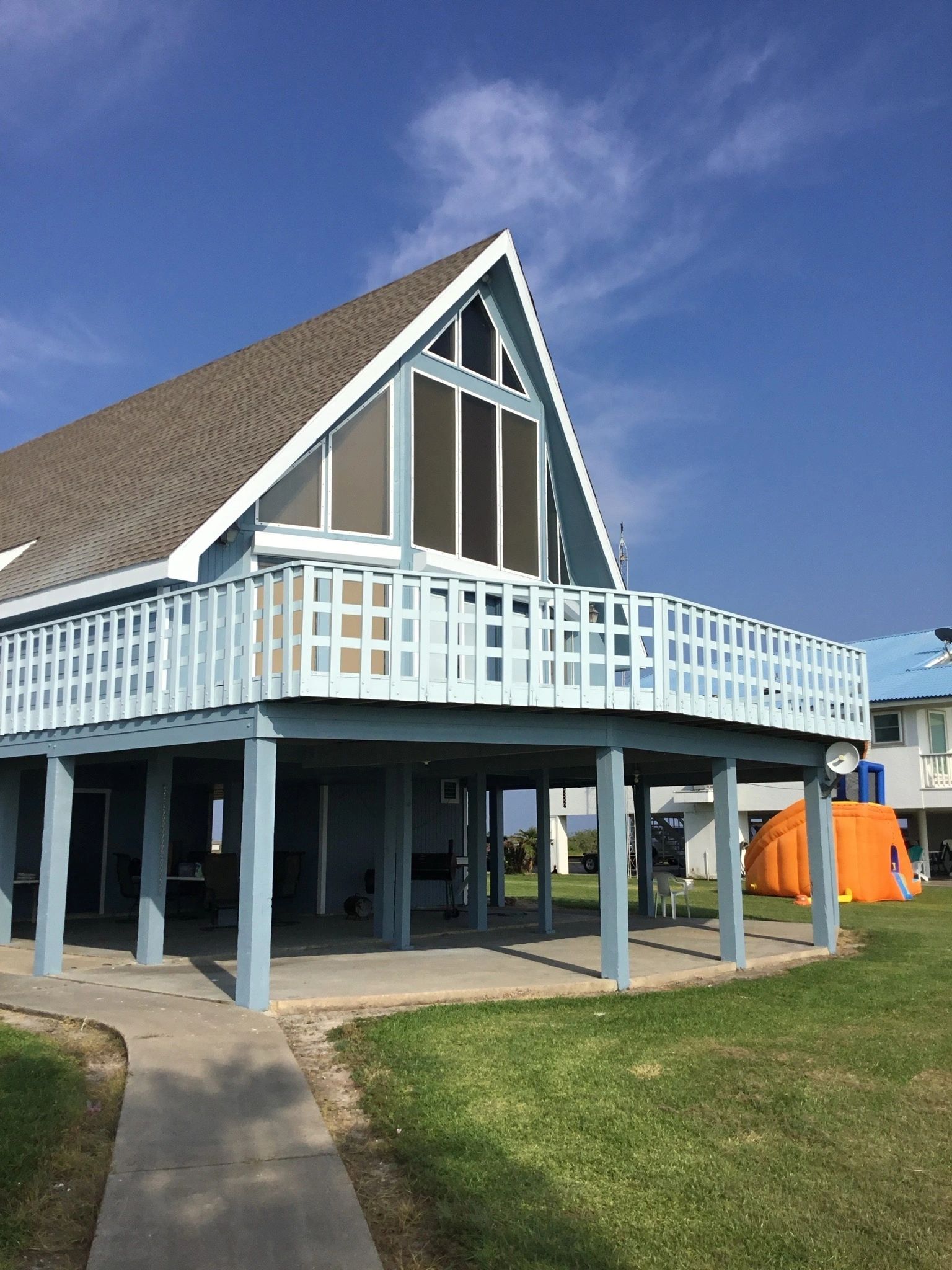 Finished siding, shingle roof and exterior stairs by Skystone Homes LLC