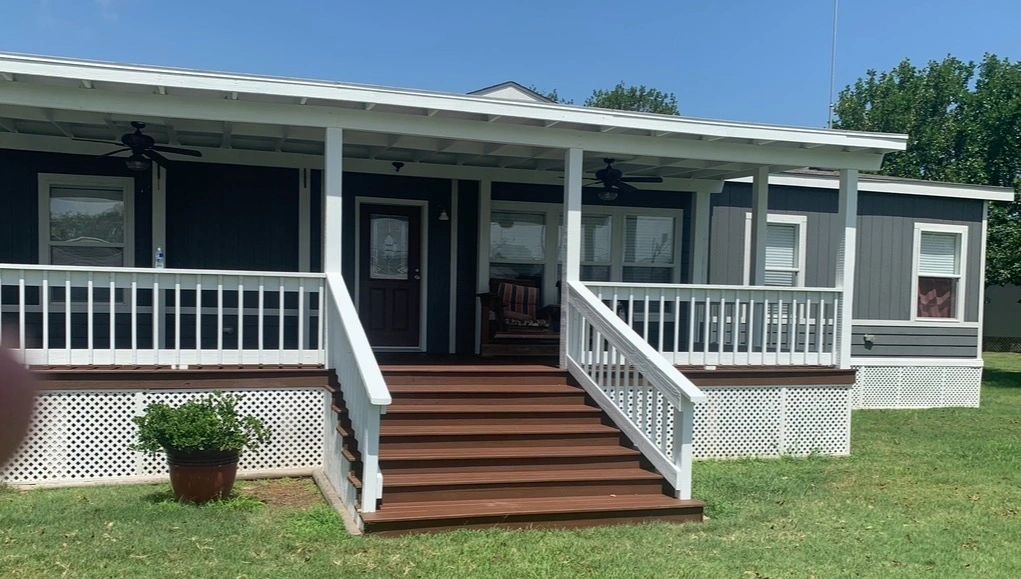 Painted deck and porch railing by Skystone Homes LLC